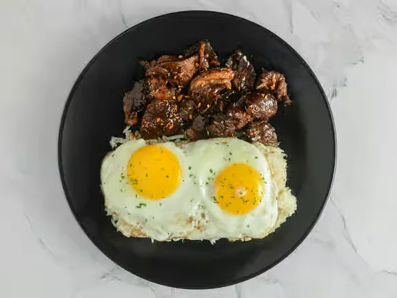 Tapsilog with garlic rice and egg at Kalesa Korner in Winnipeg, MB